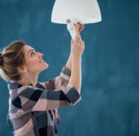 lighting designer testing a pendant fixture